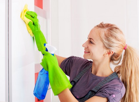Carpet cleaning team preparing equipment with safety in mind